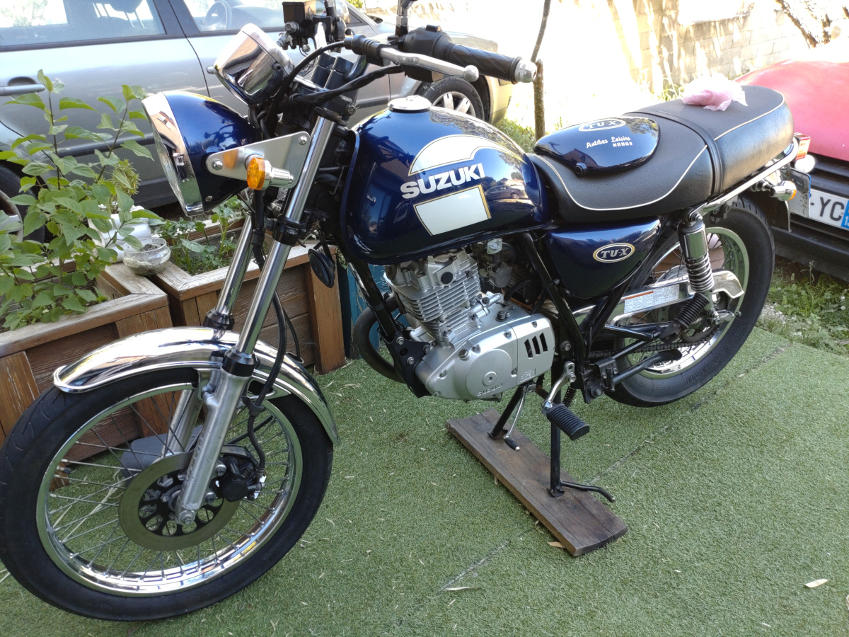 Cache latéral gauche de la SUZUKI TU-X 125 cm3 bleue d'origine miniature 3